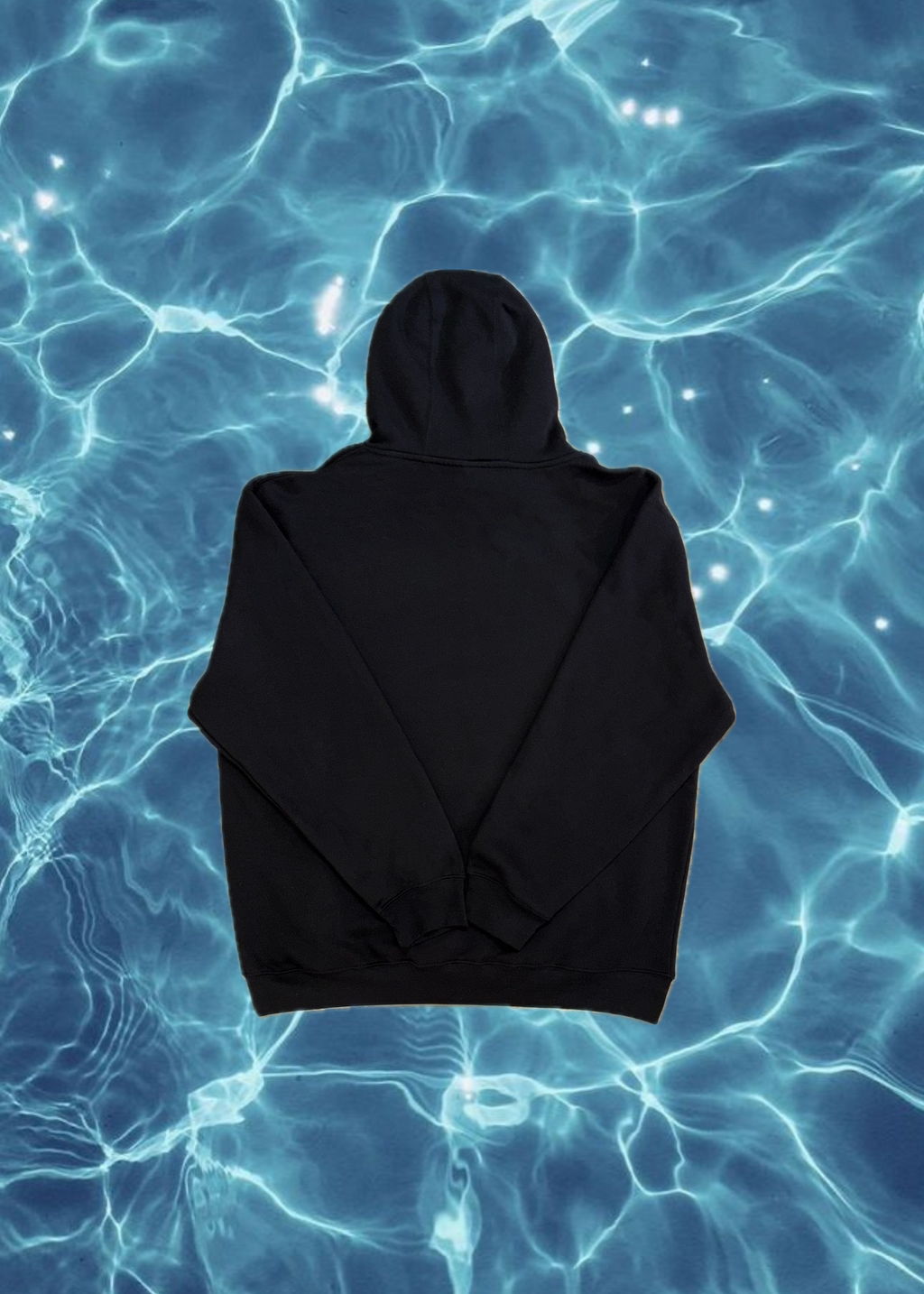 Black hoodie on a blue water background