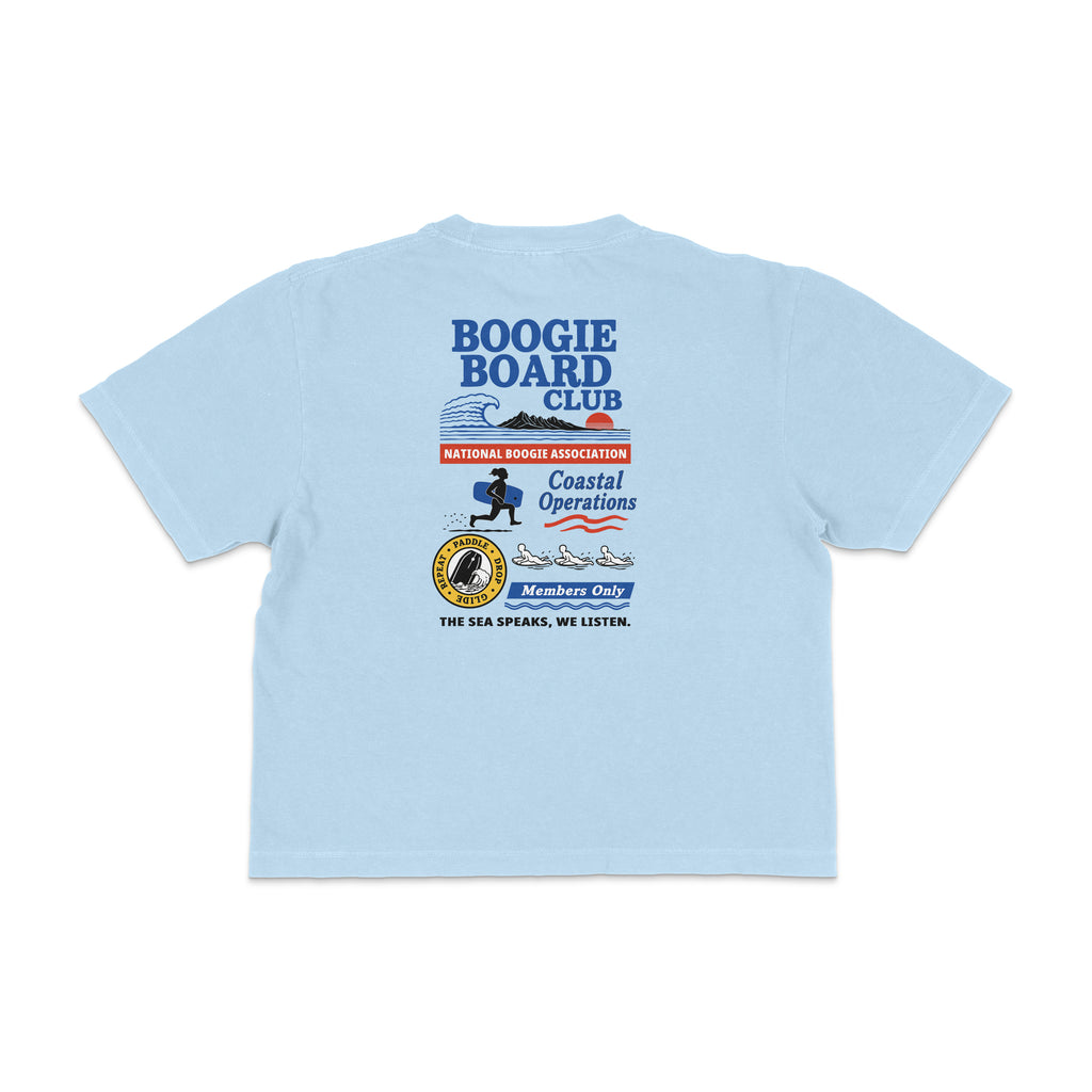 Back view of Coastal Operations Women’s Heavyweight Boxy Tee in Chambray with large multi-badge Coastal Operations graphic