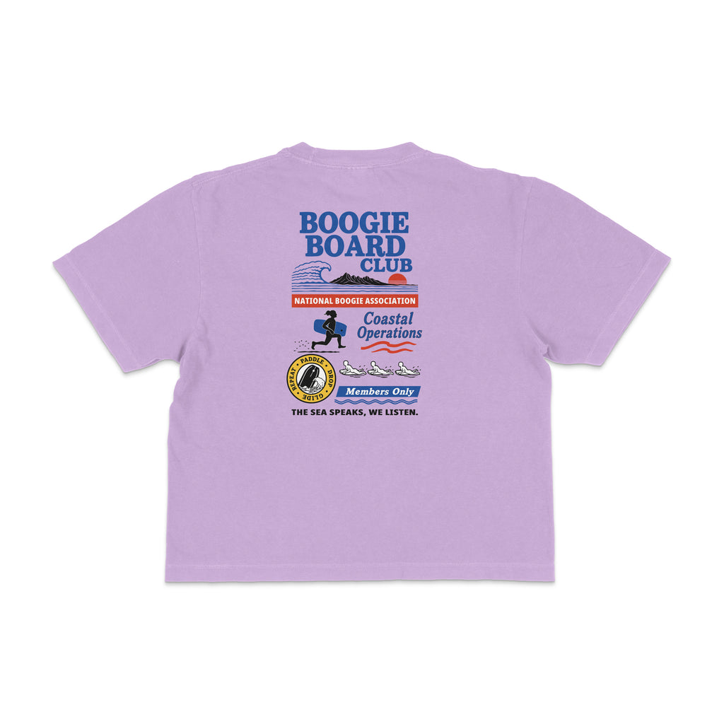 Back view of Coastal Operations Women’s Heavyweight Boxy Tee in Orchid with large multi-badge Coastal Operations graphic