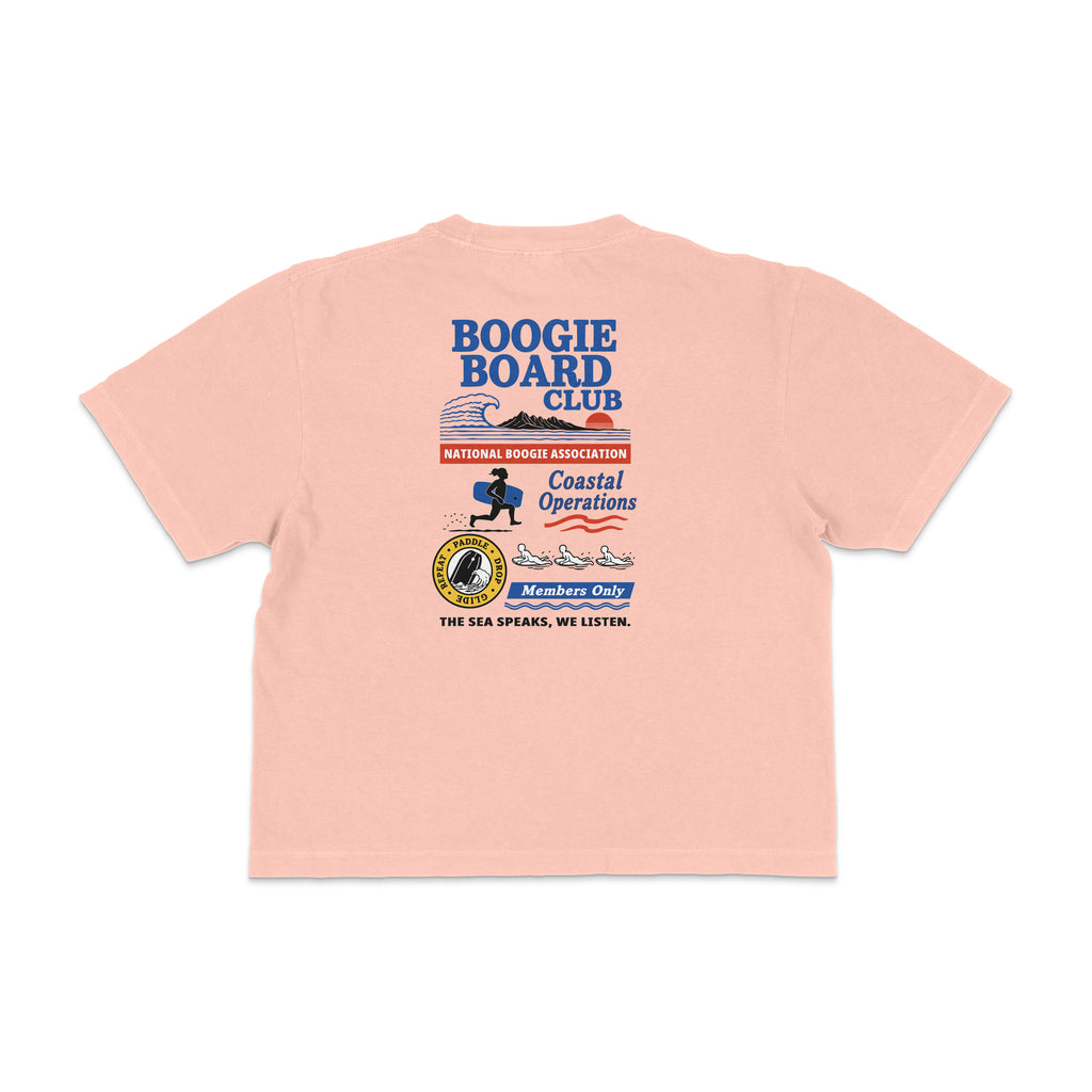 Back view of Coastal Operations Women’s Heavyweight Boxy Tee in Peachy with large multi-badge Coastal Operations graphic