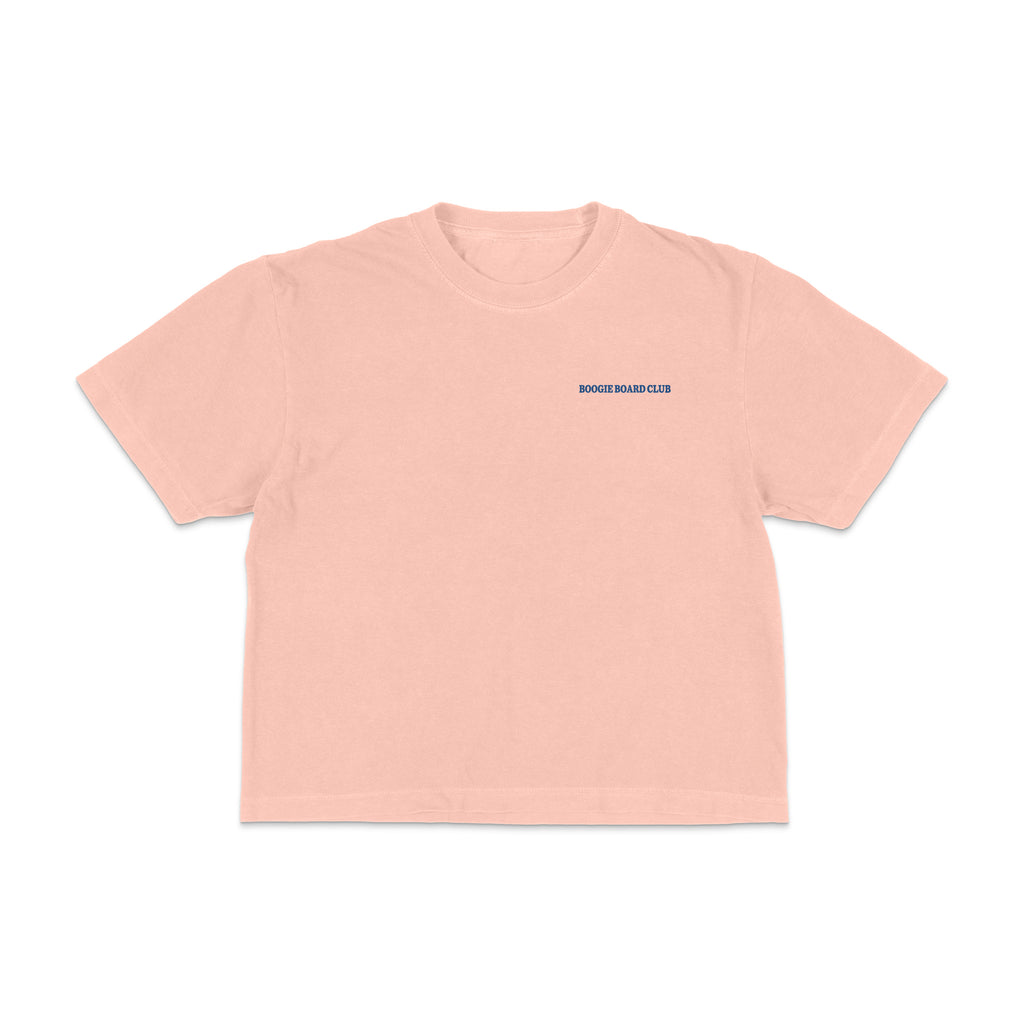 Front view of Coastal Operations Women’s Heavyweight Boxy Tee in Peachy with minimal Coastal Operations front mark