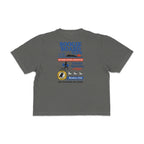 Back view of Coastal Operations Women’s Heavyweight Boxy Tee in Pepper with large multi-badge Coastal Operations graphic